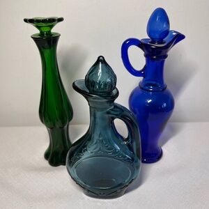 Avon Green Bud Vase and Blue Glass Decanters Trio. Vintage 70s